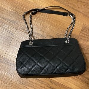 Black quilted bag with silver hardware